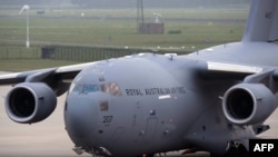 Ukraine -- An Australian Royal Air Force C-17 Globemaster carrying personal belongings found at the crash site of Malaysia Airlines MH17 lands at Eindhoven Airbase near Eindhoven on August 7, 2014. 